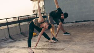 Two people stretching